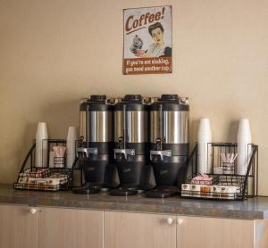 a counter with a coffee pot on top of it at River Canyon Lodge in Moab +51 photos