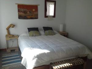 Cama ou camas em um quarto em LA FLORITA