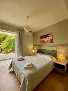 Posteľ alebo postele v izbe v ubytovaní Eirini & Manolis Apartments