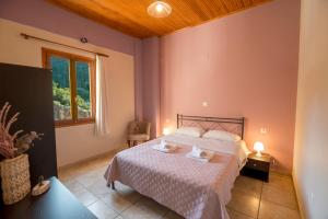 Posteľ alebo postele v izbe v ubytovaní Ntamari Apartments