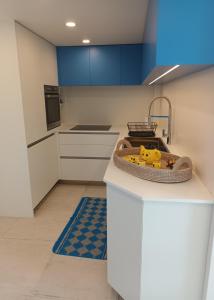 a kitchen with a counter with a toy on it at Attico Victoria Palace suggestivo e spettacolare in Menton