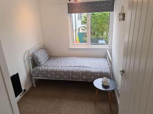 Tempat tidur dalam kamar di Beautiful 3 bed house in Hunstanton - near Searles with sea views