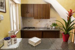 a kitchen with a sink and a counter top at Vico Tauro House in Taormina