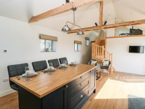 a kitchen with a large island in a room at Glowty Brynbedw in Clynderwen