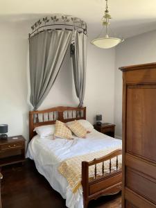 a bedroom with a bed with two pillows on it at Moulin des Forges Gites, Camping et Glamping in Moutier-Malcard +63 photos