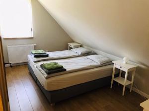 Posteľ alebo postele v izbe v ubytovaní Kaszëbsko Nórcëk + 37 fotografií