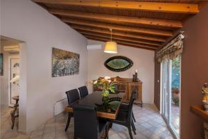 a dining room with a table and chairs at Villa René in Koskinou +42 photos