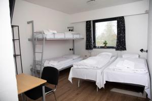 Postel nebo postele na pokoji v ubytování Danhostel Sønderborg City
