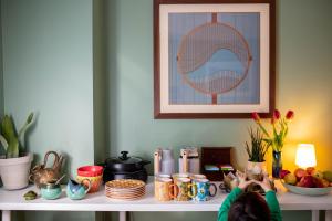 a person is sitting on a table with food on it at The Vesper Woodstock in Woodstock