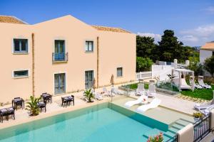 an image of a villa with a swimming pool at Hotel Baglio Di Scopello in Scopello