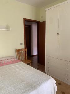 Posteľ alebo postele v izbe v ubytovaní Appartamento incantevole a pochi passi dal mare, Locazione breve turistica privata, no impresa