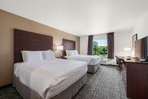 Postel nebo postele na pokoji v ubytování Cobblestone Hotel & Suites - Urbana