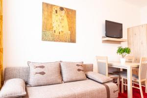TV a/nebo společenská místnost v ubytování Hotel Klimt