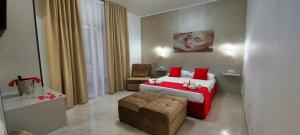 Postel nebo postele na pokoji v ubytování IL GIGLIO B&B