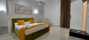 Postel nebo postele na pokoji v ubytování IL GIGLIO B&B
