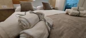 Postel nebo postele na pokoji v ubytování IL GIGLIO B&B