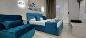 Postel nebo postele na pokoji v ubytování IL GIGLIO B&B