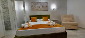 Postel nebo postele na pokoji v ubytování IL GIGLIO B&B
