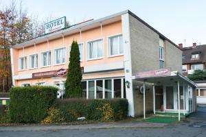 a building with a sign for a hotel at Hotel Hanseat Hamburg - Free Parking in Hamburg