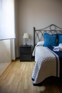 A bed or beds in a room at Casa Maia
