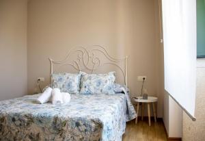 A bed or beds in a room at Casa Maia