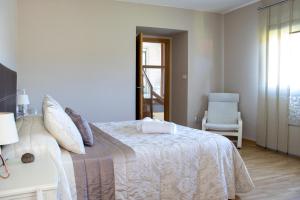 A bed or beds in a room at Casa Maia