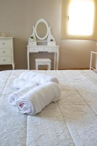 A bed or beds in a room at Casa Maia