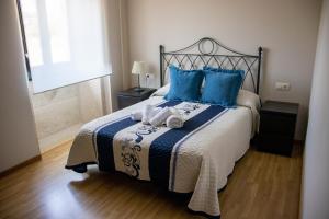 A bed or beds in a room at Casa Maia Még 22 kép