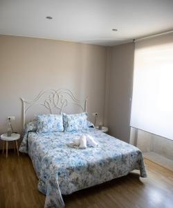 A bed or beds in a room at Casa Maia