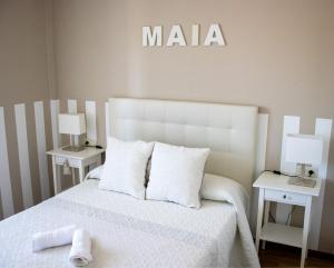 A bed or beds in a room at Casa Maia