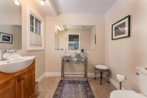 a bathroom with a sink and a toilet at Big Creek Inn in Fish Camp