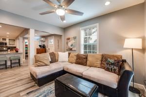 a living room with a couch and a ceiling fan at Gem 3 in Jacksonville Beach