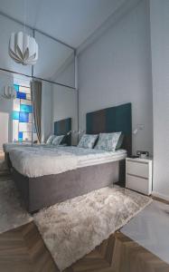 a hotel room with a bed and a desk at Basilica Apartments in Budapest
