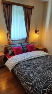 Postel nebo postele na pokoji v ubytování Tara Apartmani Malešević - 3 lux