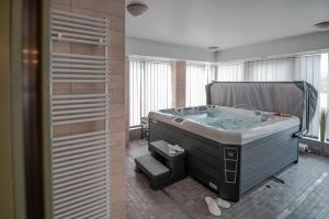 Postel nebo postele na pokoji v ubytování Szent János Hotel