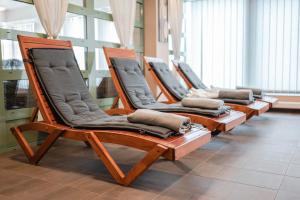 a row of chairs lined up in a room at Szent János Hotel in Mohács