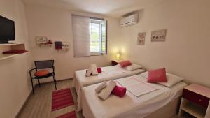 Postel nebo postele na pokoji v ubytování Bed & Breakfast Dora