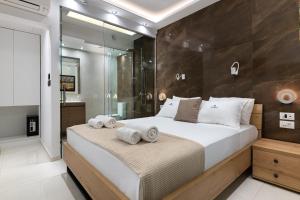 Posteľ alebo postele v izbe v ubytovaní Rhodes SkyLine Suites + 21 fotografií