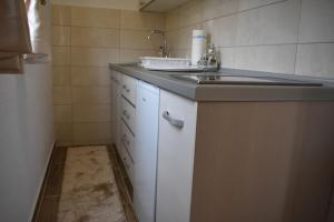 Kuchyň nebo kuchyňský kout v ubytování Deluxe Studio & Rooms Zarubica + 37 fotografií