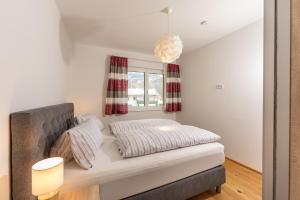 Posteľ alebo postele v izbe v ubytovaní Appartement Alpengefühl am Dachstein