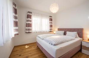 Posteľ alebo postele v izbe v ubytovaní Appartement Alpengefühl am Dachstein