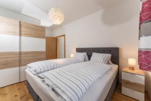 Posteľ alebo postele v izbe v ubytovaní Appartement Alpengefühl am Dachstein