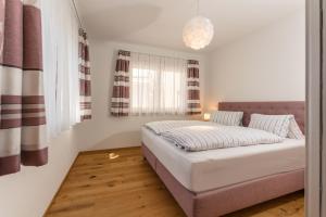 Posteľ alebo postele v izbe v ubytovaní Appartement Alpengefühl am Dachstein