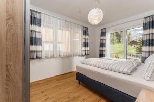 Posteľ alebo postele v izbe v ubytovaní Appartement Alpengefühl am Dachstein