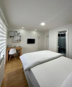 Katil atau katil-katil dalam bilik di Apartmani GO Bugojno