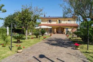 a house with a pathway in front of it at Villa Brunella in Agropoli