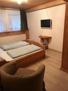 Postel nebo postele na pokoji v ubytování Pension am Eichenhain