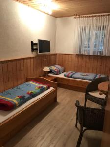 Postel nebo postele na pokoji v ubytování Pension am Eichenhain