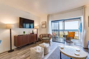 a living room with a view of the ocean at Oceanfront Oasis in Jacksonville Beach