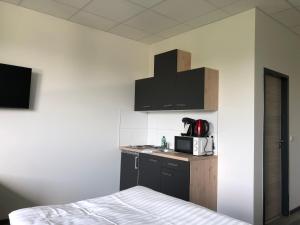 Kuchyň nebo kuchyňský kout v ubytování Pension Gästehaus Kautz